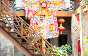 Naklejka premium Chinese woman dress traditional cheongsam . Chinese new year concept.