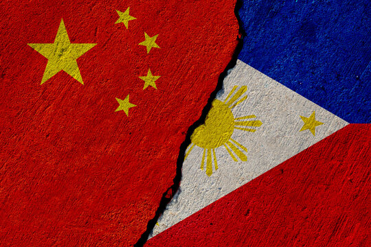 chinese and philippines flags painted on cracked concrete wall, china and philippine conflict or partnership concept
