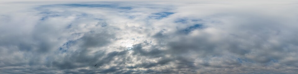 Overcast sky panorama on sunset with Cumulus clouds in Seamless spherical equirectangular format as full zenith for use in 3D graphics, game and aerial drone 360 degree panoramas for sky replacement.