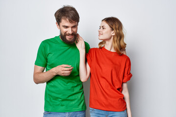 Fototapeta premium a young couple hug friendship colorful t-shirts family studio lifestyle