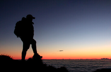 Silhouette of Hiker in the Mountain with a Sea of Clouds