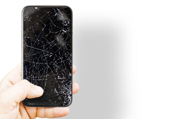 Black mobile phone with broken screen. Cracked smartphone in hand - obrazy, fototapety, plakaty