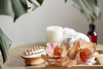 Fototapeta na wymiar Spa composition with Thai orchid flowers and bath accessories.