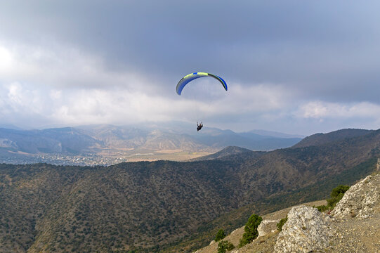 Paraglider high in the sky over the Crimean Mountains.