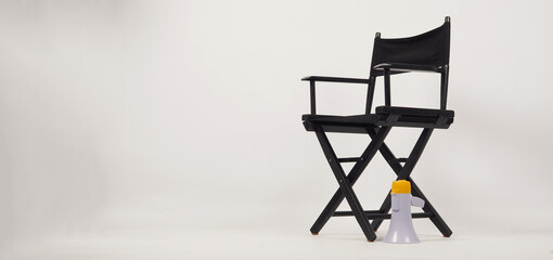 Black director chair and Clapper board with yellow megaphone on white background