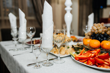 beautifully set table at a wedding banquet with delicious food and alcohol