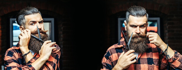 Hairdresser scissor. Bearded man, bearded male. Portrait of stylish man with classic long beard with barber scissors, barber shop. Vintage barbershop. Banner for hair salon.