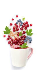 Composition - a berry fountain from a white cup.
