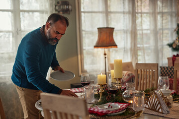 Middle age man serving festive holiday table
