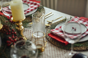 Beautiful table setting for Christmas party with fir elegant candles
