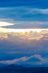 Sunset with colorful clouds in the sky in a mountainous landscape