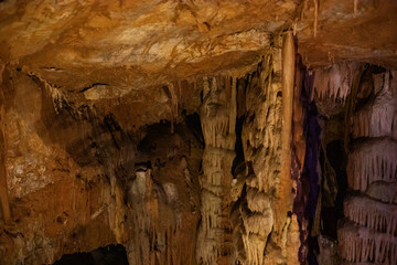 abstract background of stalactites, stalagmites and stalagnates in a cave, underground,