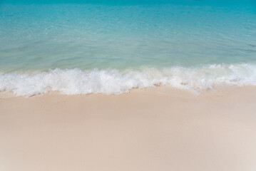 Fototapeta na wymiar Background blue sea and sand at the beach