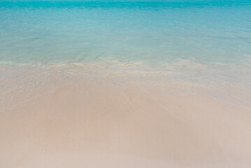 Fototapeta na wymiar Background blue sea and sand at the beach