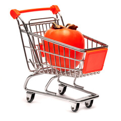 Studio shot of ripe persimmon in shopping basket isolated on white background