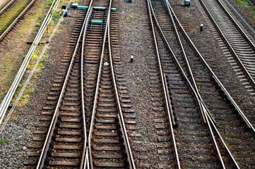 Fototapeta na wymiar railway tracks and switches for train traffic near the railway station, perspective view