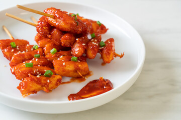 deep fried Korean rice cake (Tteokbokki) skewered with spicy sauce
