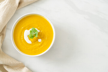 pumpkin soup in white bowl