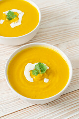 pumpkin soup in white bowl