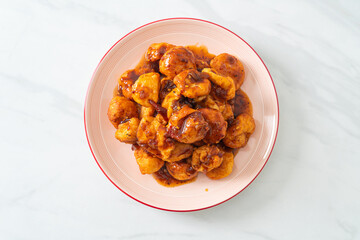 fried meatballs with spicy dipping sauce