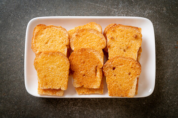 baked crispy bread with butter and sugar