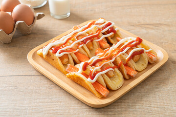 flat pancake roll with sausage and crab stick