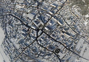 aerial shot of the snow covered village Fohnsdorf in Austria