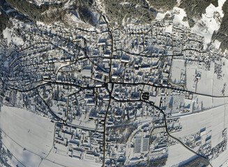 aerial shot of the snow covered village Fohnsdorf in Austria