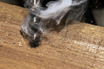 Drill a hole in the wood