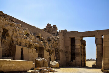 One of halls in historical complex of Karnak temples on blue sky background. Famous Egyptian...