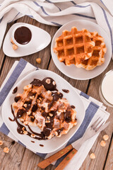 Waffles with chocolate cream and hazelnuts.