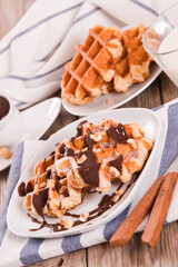 Waffles with chocolate cream and hazelnuts.