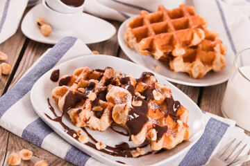 Waffles with chocolate cream and hazelnuts.