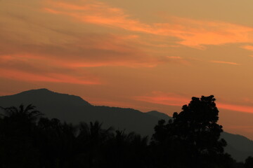 Orange light ,silhouette and clouds sky in the morning