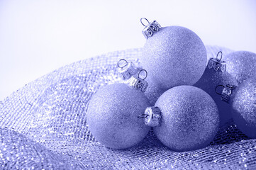 Trendy color of year 2022 Very Peri. Christmas Balls on Light Background. Minimal New Year Holiday Composition