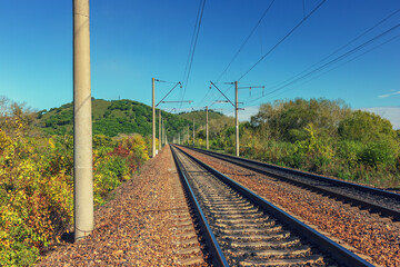 Obraz premium The railroad goes to the hills. Autumn.