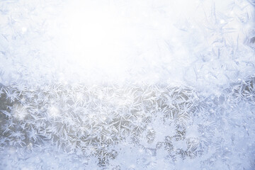 frost patterns on window glass, abstract background winter rime snow