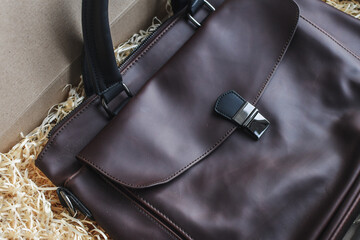 Detail of fashionable brown man leather bag. Selective focus.