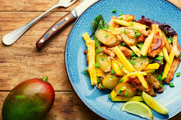 Fried chicken breast and mango