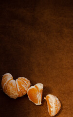 peeled tangerine on wooden background