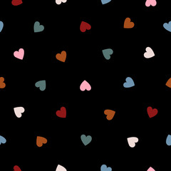 Seamless pattern with hearts on black background. Vector hand drawn illustration.