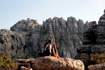 Obraz premium Mother and daughter relaxing, observing the Torcal rock formations, near Antequera.