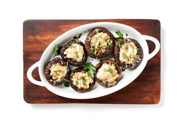 Baked mushroom caps stuffed with chicken meat, parmesan cheese, garlic and herbs. isolated on white background. top view