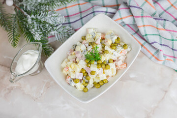 Russian salad festive Olivier with vegetables and sausage