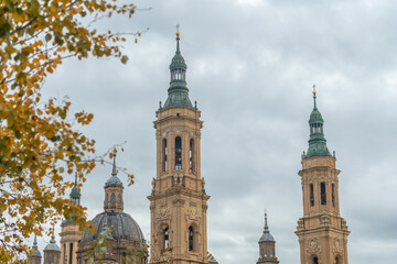 Fototapeta na wymiar Towers of the Basilica de Nuestra Señora del Pilar from the Ebro river in the city of Zaragoza, Aragon. Spain