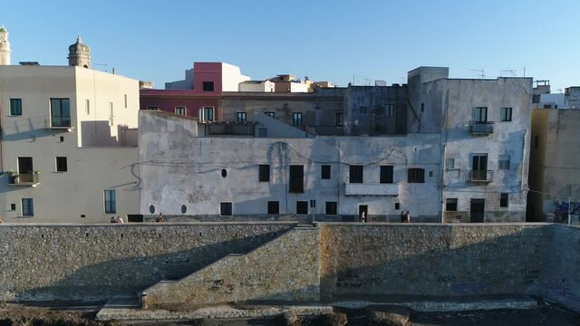 Low altitude aerial view of Trapani city center is ancient town and municipality comune on the west coast of Sicily in Italy founded by Elymians it is still an important fishing port 4k resolution