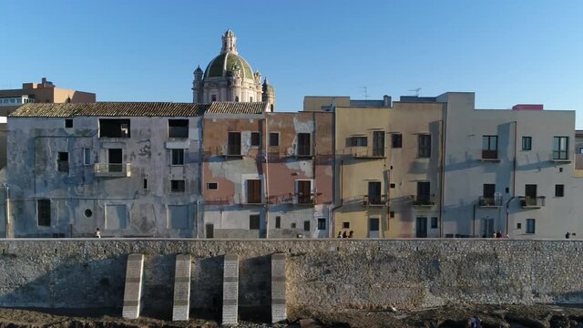 Low altitude aerial view of Trapani city center is an ancient town and municipality comune on the west coast of Sicily in Italy founded by Elymians it is still an important fishing port 4k resolution