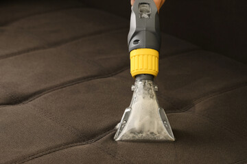 Deep professional cleaning of sofa with vaccum cleaner - 474495376