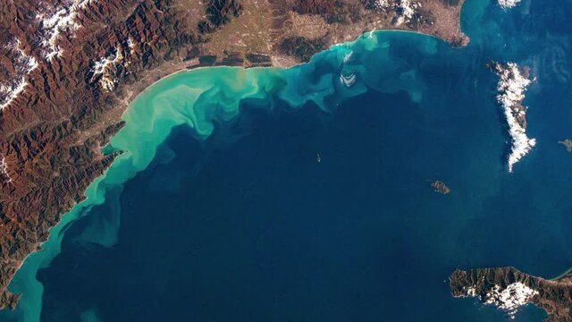 Tuscany coastline Mediterranean sea Italy and Elba island aerial satellite view from space. Based on image furnished by Nasa