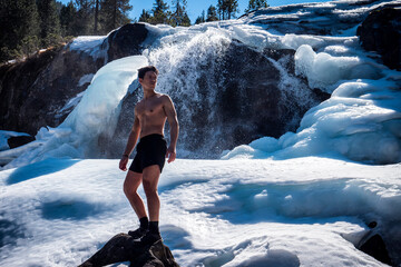 Shirtless Young Athletic Man Outdoor in Country Standing on Snow.